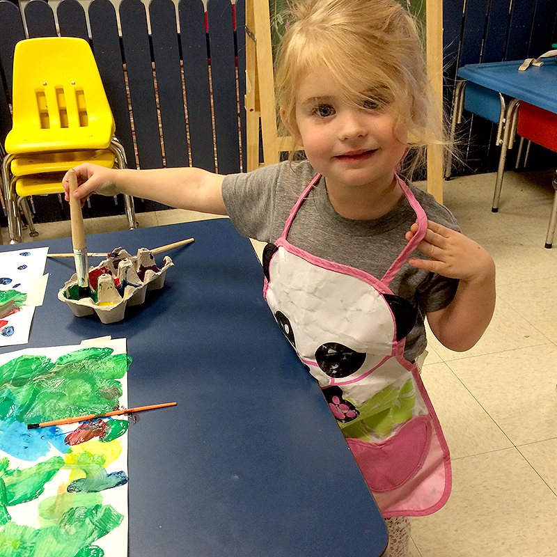 Toddler Painting at Cubs Camp Nursery