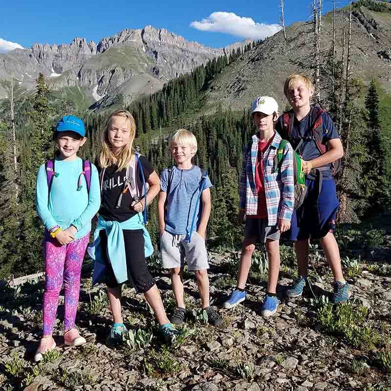 Five kids on a mountain ridge in Telluride.