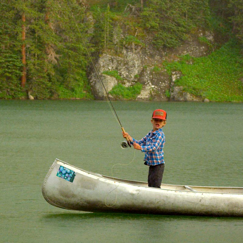 Kid Fishing from Canoe in Telluride